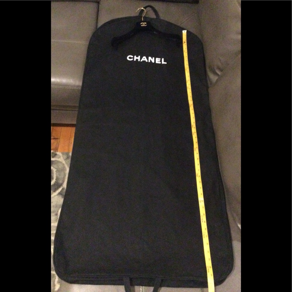Authentic CHANEL garment bag, including CHANEL logo hanger.
